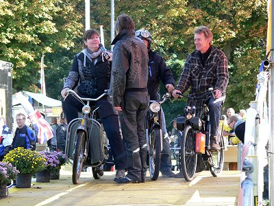 A group od moped riders being interviewed