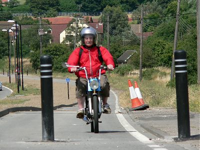 Here comes one - confused by the weird road layout, Evans ends up on the cycle pat