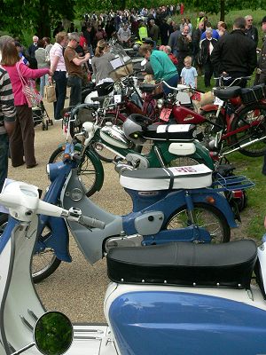 Scooters, mopeds and motor cycles stretching into the distance