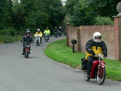 Terry on a Runabout leads Paul on the Solo and the rest of the pack