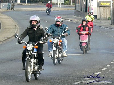 Carole and Bill on Yamahas, Lindsay on a Sym