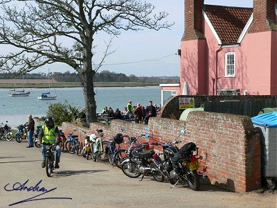 Bikes lined up along the pub wall