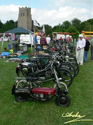 The line up of bikes on the club stand