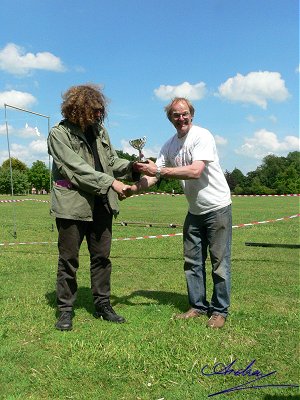 Ralph presents Nick with the valuable trophy