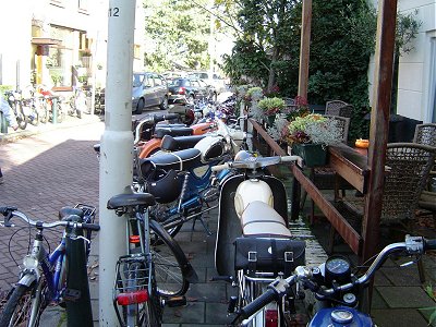 A pavement full of mopeds
