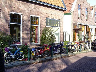 A pavement full of mopeds