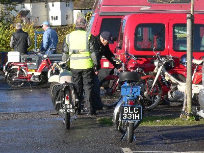 Mopeds being unloaded and prepared for the run
