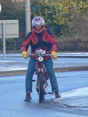 Chris does the same - even though his autocycle has a stand!