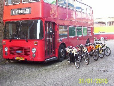 Puch mopeds and a red bus
