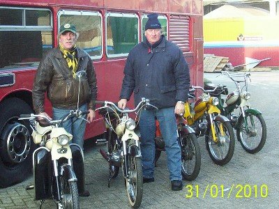 Puch mopeds and a red bus