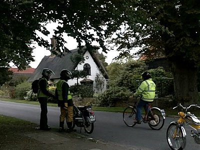 Dave rides past on the Cyclemaster