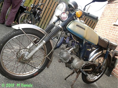 Honda SS50 outside Bucklesham Village Hall