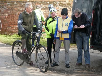 Next rider waits while the timekeepers compare notes
